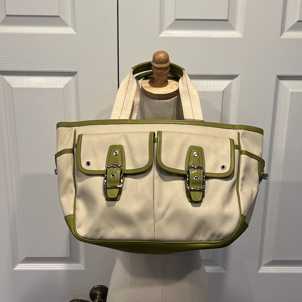Cream colored COACH purse with green lining/detail